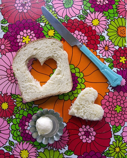 a slice of classic rich bread with a heart cut out