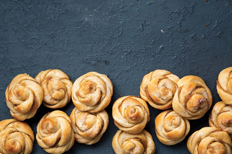 Pear Cardamom Buns | With a mesmerizing yet easy-to-execute shape, these buns are spiced with bold, complex cardamom—the ideal companion for the subtly flavored pear. Slathered in every twist and curve of the golden dough, the homemade Pear Butter is a great way to make use of overripe pears and melts in your mouth with every bite. Find recipe at redstaryeast.com.