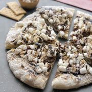 S'mores Grilled Pizza | Start a new summer tradition with this homemade dessert pizza. Made with a grilled artisan pizza crust and all the traditional s’mores fixings plus a layer of chocolate hazelnut spread. The perfect dessert with your family or for your next get-together! Find recipe at redstaryeast.com.