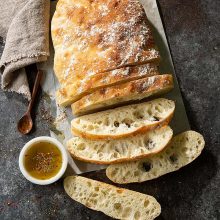Homemade Ciabatta | This high hydration dough is made using a folding technique to create the open crumb structure and big air pockets you expect in light, airy ciabatta. This recipe yields one large loaf that&rsquo;s perfect for sharing. You can even use it to make family-style sandwiches. Get recipe and folding + shaping video at redstaryeast.com.