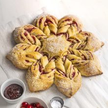 Cranberry Raspberry Star Bread | This show-stopper bread is so easy to make! A simple no-knead enriched dough layered with almond and cranberry-raspberry filling, this beautiful star bread is perfect for holiday celebrations or an everyday treat. Get recipe and video tutorial at redstaryeast.com.