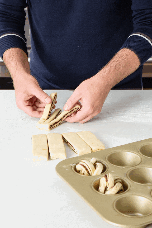 Baker rolling dough knots