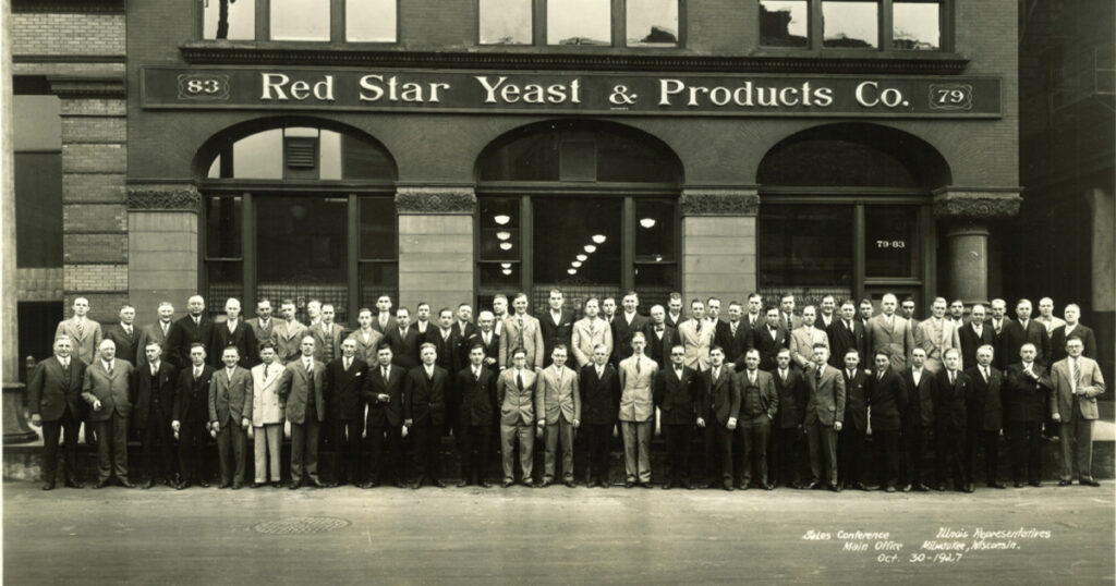 Illinois State Representatives standing in front of Red Star Yeast Products Company headquarters in Milwaukee